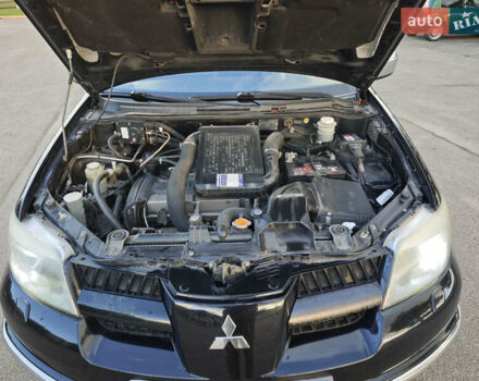 Чорний Міцубісі Аутлендер, об'ємом двигуна 2 л та пробігом 207 тис. км за 6900 $, фото 15 на Automoto.ua