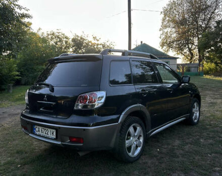 Мицубиси Аутлендер 2006 в Чернобае на Automoto.ua Черный Мицубиси Аутлендер, объемом двигателя 2.38 л и пробегом 278 тыс. км за 5300 $, фото 5 на Automoto.ua