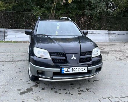 Черный Мицубиси Аутлендер, объемом двигателя 2 л и пробегом 280 тыс. км за 4999 $, фото 10 на Automoto.ua