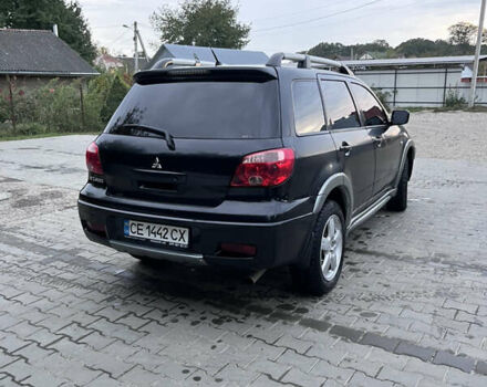 Черный Мицубиси Аутлендер, объемом двигателя 2 л и пробегом 280 тыс. км за 4999 $, фото 8 на Automoto.ua