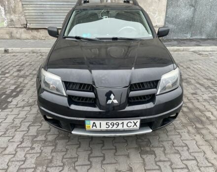 Черный Мицубиси Аутлендер, объемом двигателя 2.4 л и пробегом 234 тыс. км за 5499 $, фото 18 на Automoto.ua