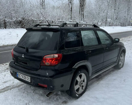 Чорний Міцубісі Аутлендер, об'ємом двигуна 2.4 л та пробігом 308 тис. км за 4700 $, фото 3 на Automoto.ua