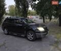 Черный Мицубиси Аутлендер, объемом двигателя 2 л и пробегом 370 тыс. км за 7000 $, фото 1 на Automoto.ua