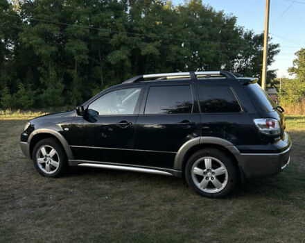 Мицубиси Аутлендер 2006 в Чернобае на Automoto.ua Черный Мицубиси Аутлендер, объемом двигателя 2.38 л и пробегом 278 тыс. км за 5300 $, фото 2 на Automoto.ua
