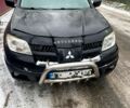 Черный Мицубиси Аутлендер, объемом двигателя 2 л и пробегом 300 тыс. км за 4600 $, фото 1 на Automoto.ua