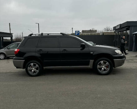 Чорний Міцубісі Аутлендер, об'ємом двигуна 2 л та пробігом 297 тис. км за 6200 $, фото 10 на Automoto.ua