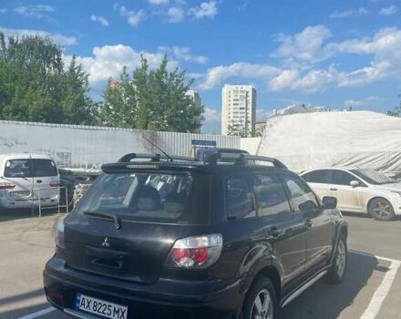 Черный Мицубиси Аутлендер, объемом двигателя 2.38 л и пробегом 260 тыс. км за 5000 $, фото 3 на Automoto.ua