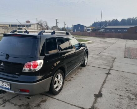 Черный Мицубиси Аутлендер, объемом двигателя 2 л и пробегом 169 тыс. км за 3500 $, фото 1 на Automoto.ua