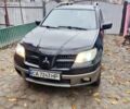 Чорний Міцубісі Аутлендер, об'ємом двигуна 2.38 л та пробігом 275 тис. км за 5700 $, фото 1 на Automoto.ua