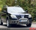 Черный Мицубиси Аутлендер, объемом двигателя 2.4 л и пробегом 263 тыс. км за 5999 $, фото 1 на Automoto.ua