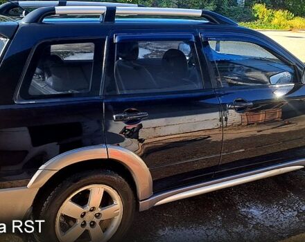 Черный Мицубиси Аутлендер, объемом двигателя 2.4 л и пробегом 185 тыс. км за 7500 $, фото 6 на Automoto.ua