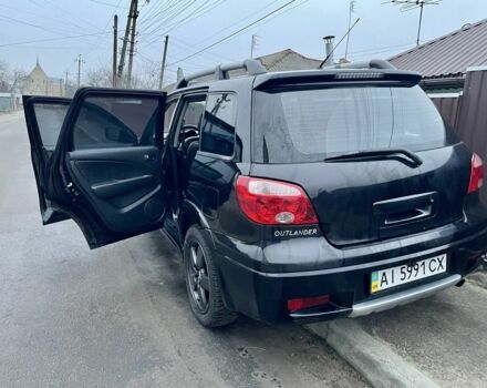 Черный Мицубиси Аутлендер, объемом двигателя 2.4 л и пробегом 234 тыс. км за 5499 $, фото 4 на Automoto.ua