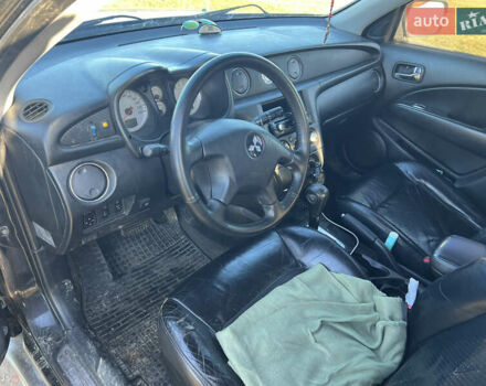 Черный Мицубиси Аутлендер, объемом двигателя 2.38 л и пробегом 230 тыс. км за 5350 $, фото 9 на Automoto.ua