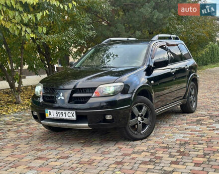 Чорний Міцубісі Аутлендер, об'ємом двигуна 2.38 л та пробігом 247 тис. км за 5499 $, фото 1 на Automoto.ua