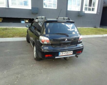 Черный Мицубиси Аутлендер, объемом двигателя 2.4 л и пробегом 240 тыс. км за 5700 $, фото 5 на Automoto.ua