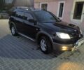 Черный Мицубиси Аутлендер, объемом двигателя 2 л и пробегом 250 тыс. км за 5400 $, фото 1 на Automoto.ua