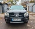 Черный Мицубиси Аутлендер, объемом двигателя 2.4 л и пробегом 256 тыс. км за 6900 $, фото 1 на Automoto.ua
