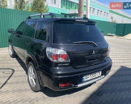 Черный Мицубиси Аутлендер, объемом двигателя 2 л и пробегом 212 тыс. км за 6000 $, фото 24 на Automoto.ua