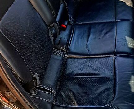 Черный Мицубиси Аутлендер, объемом двигателя 2.4 л и пробегом 185 тыс. км за 7500 $, фото 2 на Automoto.ua