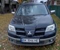 Чорний Міцубісі Аутлендер, об'ємом двигуна 2 л та пробігом 320 тис. км за 4500 $, фото 1 на Automoto.ua