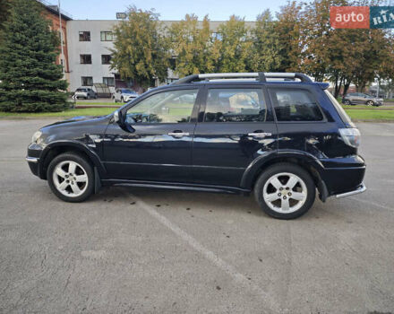 Чорний Міцубісі Аутлендер, об'ємом двигуна 2 л та пробігом 207 тис. км за 6900 $, фото 8 на Automoto.ua