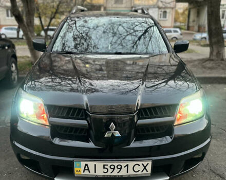 Чорний Міцубісі Аутлендер, об'ємом двигуна 2.38 л та пробігом 247 тис. км за 5499 $, фото 42 на Automoto.ua