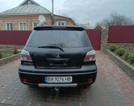 Черный Мицубиси Аутлендер, объемом двигателя 2 л и пробегом 200 тыс. км за 5100 $, фото 2 на Automoto.ua