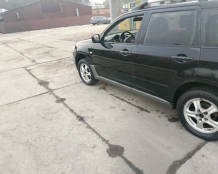 Черный Мицубиси Аутлендер, объемом двигателя 2 л и пробегом 169 тыс. км за 3500 $, фото 2 на Automoto.ua