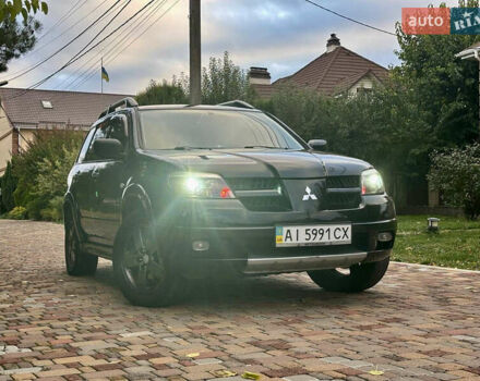 Чорний Міцубісі Аутлендер, об'ємом двигуна 2.38 л та пробігом 247 тис. км за 5499 $, фото 37 на Automoto.ua