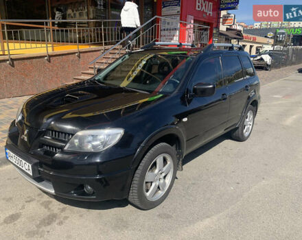Черный Мицубиси Аутлендер, объемом двигателя 2 л и пробегом 212 тыс. км за 6000 $, фото 1 на Automoto.ua