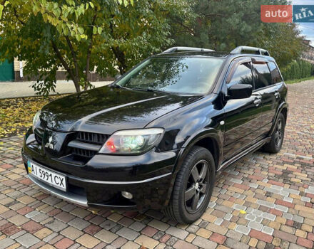 Чорний Міцубісі Аутлендер, об'ємом двигуна 2.38 л та пробігом 247 тис. км за 5499 $, фото 6 на Automoto.ua