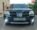 Чорний Міцубісі Аутлендер, об'ємом двигуна 2.38 л та пробігом 285 тис. км за 6700 $, фото 1 на Automoto.ua