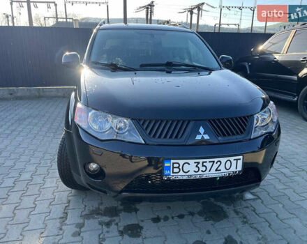 Чорний Міцубісі Аутлендер, об'ємом двигуна 2 л та пробігом 330 тис. км за 7500 $, фото 1 на Automoto.ua