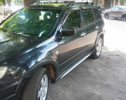 Черный Мицубиси Аутлендер, объемом двигателя 2.4 л и пробегом 248 тыс. км за 7000 $, фото 1 на Automoto.ua