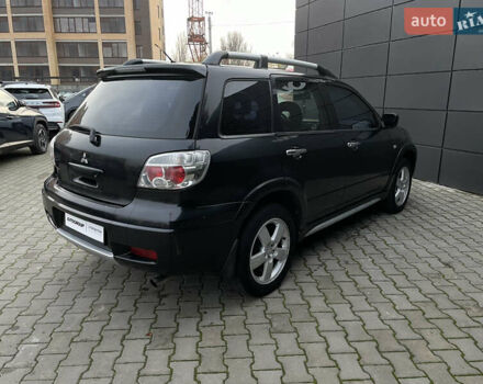 Черный Мицубиси Аутлендер, объемом двигателя 2.4 л и пробегом 248 тыс. км за 7300 $, фото 22 на Automoto.ua