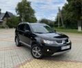 Черный Мицубиси Аутлендер, объемом двигателя 2.4 л и пробегом 200 тыс. км за 7500 $, фото 1 на Automoto.ua