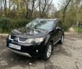 Черный Мицубиси Аутлендер, объемом двигателя 2.4 л и пробегом 230 тыс. км за 8500 $, фото 1 на Automoto.ua
