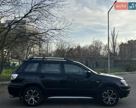 Черный Мицубиси Аутлендер, объемом двигателя 2.4 л и пробегом 320 тыс. км за 5999 $, фото 3 на Automoto.ua