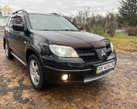 Черный Мицубиси Аутлендер, объемом двигателя 2.4 л и пробегом 213 тыс. км за 6850 $, фото 4 на Automoto.ua