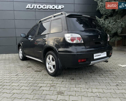 Черный Мицубиси Аутлендер, объемом двигателя 2.4 л и пробегом 248 тыс. км за 7300 $, фото 19 на Automoto.ua
