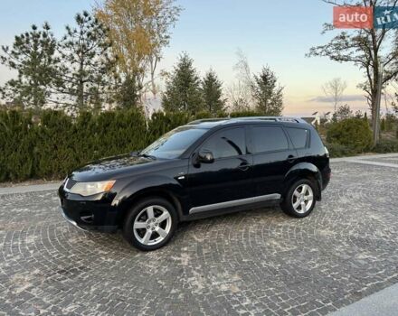 Черный Мицубиси Аутлендер, объемом двигателя 3 л и пробегом 205 тыс. км за 11300 $, фото 1 на Automoto.ua