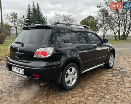 Чорний Міцубісі Аутлендер, об'ємом двигуна 2.4 л та пробігом 213 тис. км за 6850 $, фото 7 на Automoto.ua