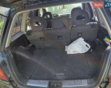 Чорний Міцубісі Аутлендер, об'ємом двигуна 2 л та пробігом 260 тис. км за 5500 $, фото 6 на Automoto.ua