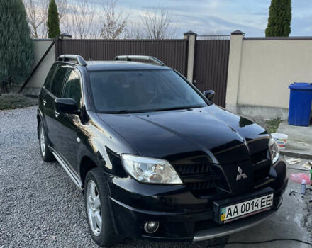 Черный Мицубиси Аутлендер, объемом двигателя 2.38 л и пробегом 118 тыс. км за 6850 $, фото 1 на Automoto.ua
