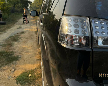 Черный Мицубиси Аутлендер, объемом двигателя 2 л и пробегом 200 тыс. км за 7700 $, фото 11 на Automoto.ua