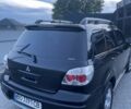 Черный Мицубиси Аутлендер, объемом двигателя 2 л и пробегом 130 тыс. км за 7100 $, фото 12 на Automoto.ua