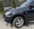Черный Мицубиси Аутлендер, объемом двигателя 2 л и пробегом 130 тыс. км за 7100 $, фото 2 на Automoto.ua