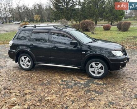 Чорний Міцубісі Аутлендер, об'ємом двигуна 2.4 л та пробігом 213 тис. км за 6850 $, фото 5 на Automoto.ua