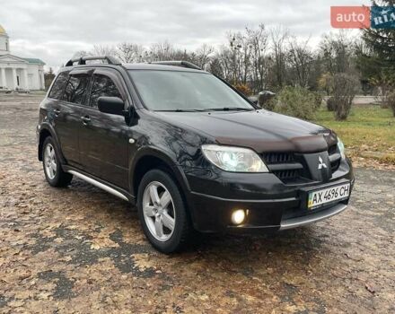 Чорний Міцубісі Аутлендер, об'ємом двигуна 2.4 л та пробігом 213 тис. км за 6850 $, фото 3 на Automoto.ua