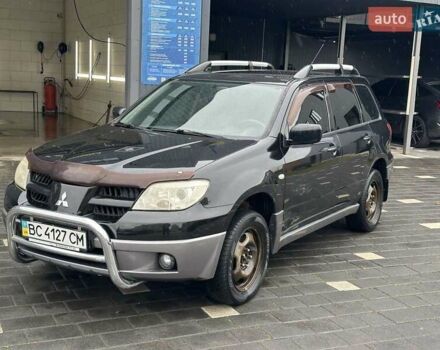 Черный Мицубиси Аутлендер, объемом двигателя 2 л и пробегом 295 тыс. км за 5300 $, фото 15 на Automoto.ua
